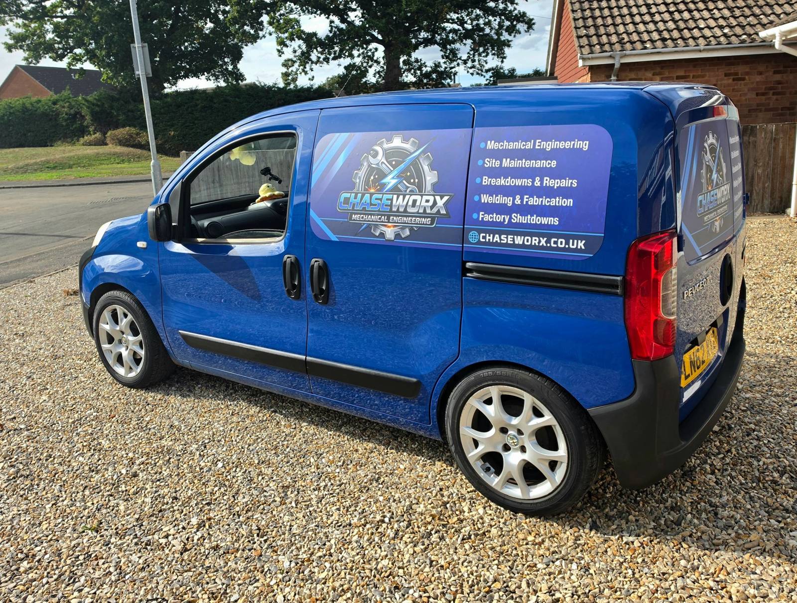 Blue Chase Worx service van parked on gravel.