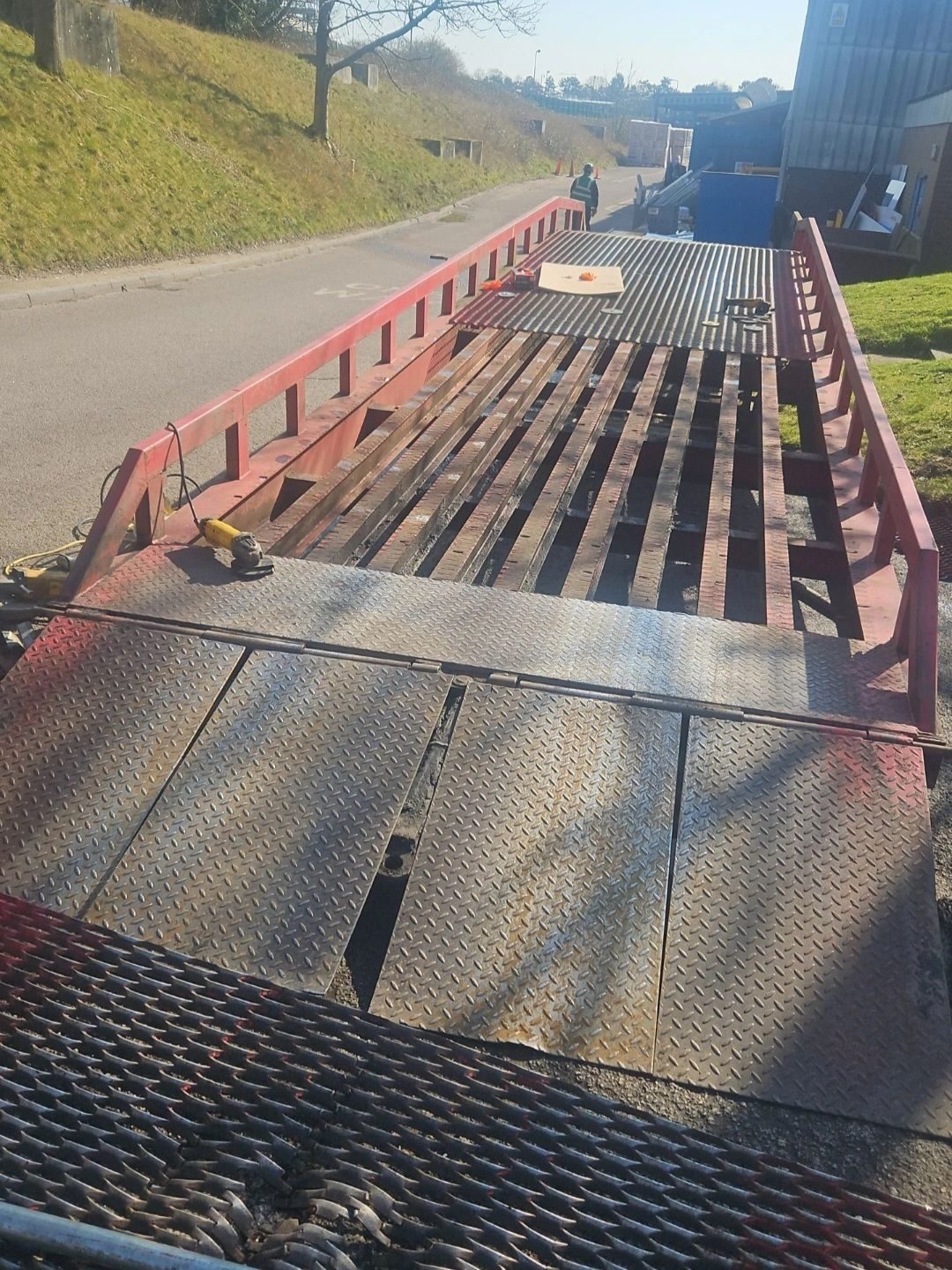 Steel mesh deck of a red loading ramp