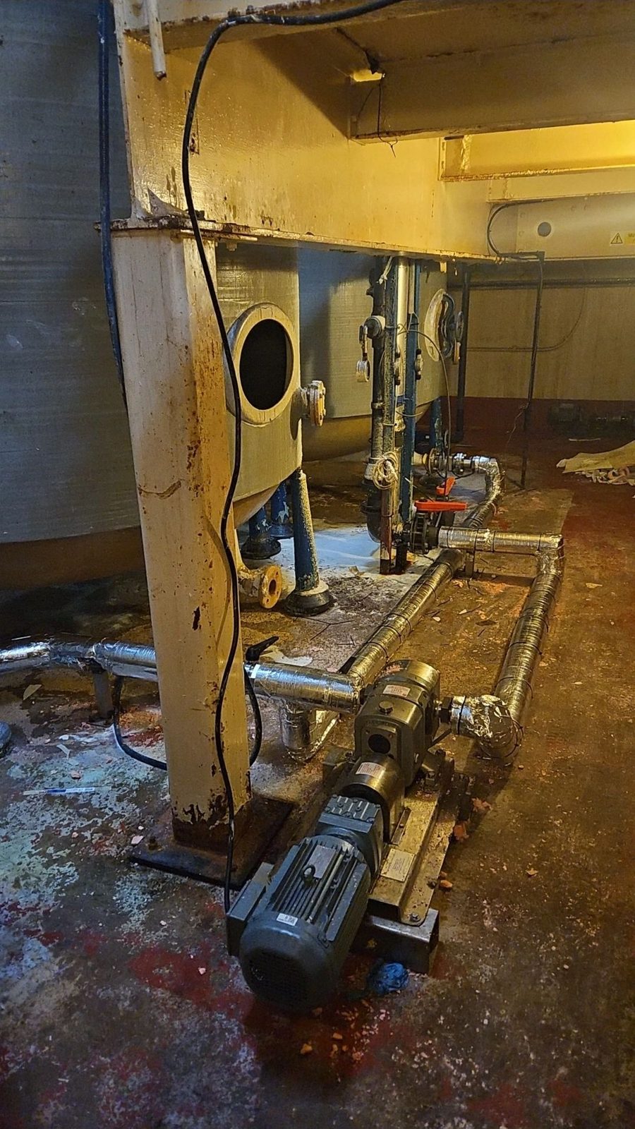 Pump and pipework on a skid in a plant room